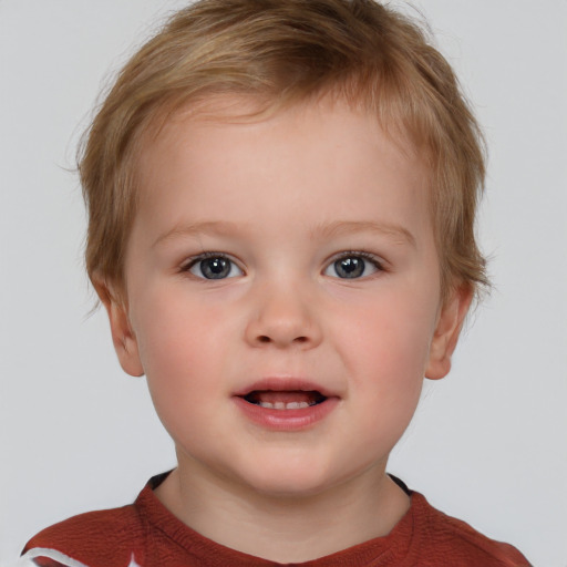 Joyful white child male with short  brown hair and brown eyes