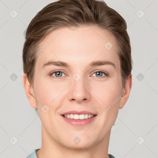 Joyful white young-adult female with short  brown hair and grey eyes