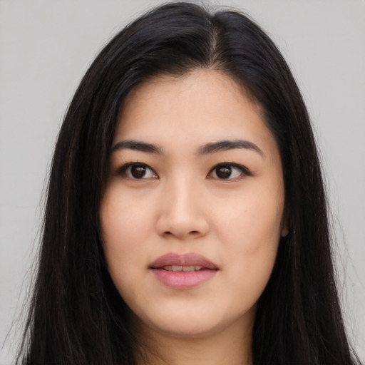 Joyful asian young-adult female with long  black hair and brown eyes