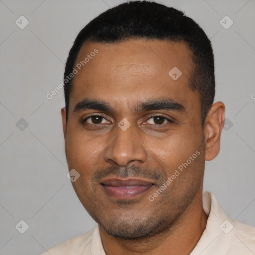 Joyful black young-adult male with short  black hair and brown eyes