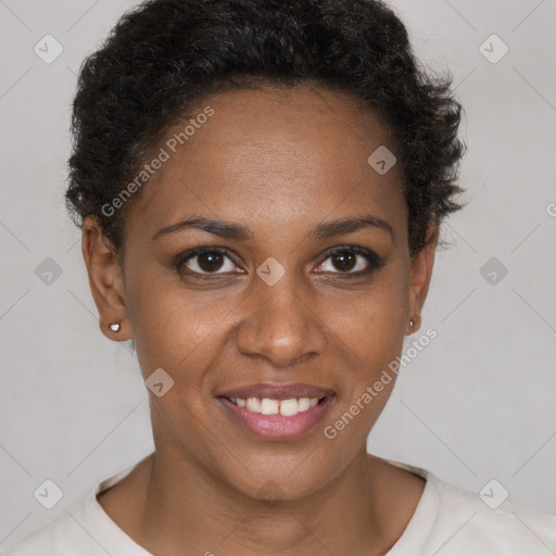 Joyful black young-adult female with short  brown hair and brown eyes