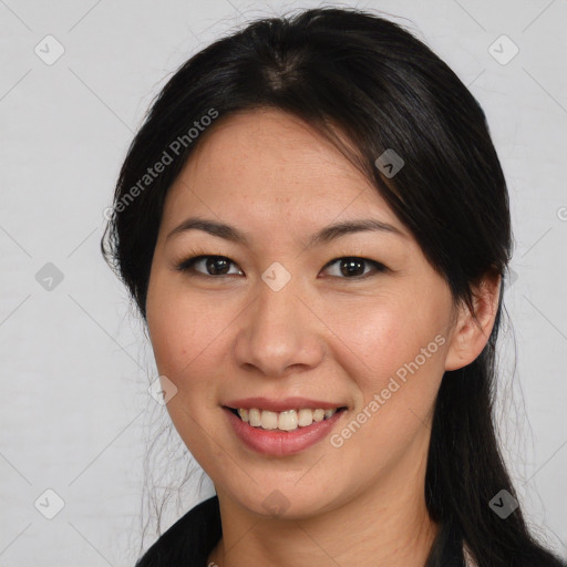 Joyful asian young-adult female with long  brown hair and brown eyes