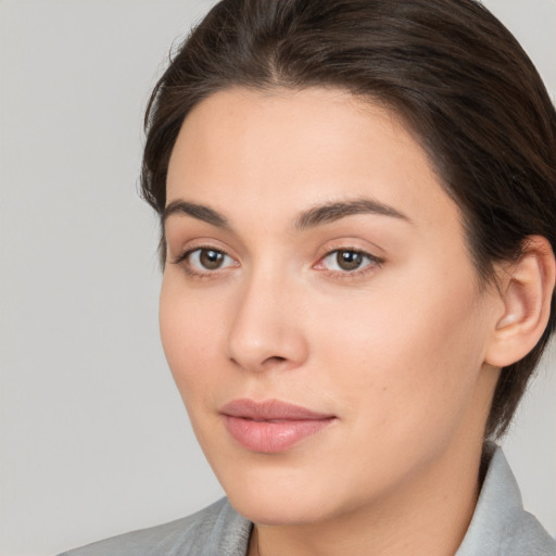 Neutral white young-adult female with medium  brown hair and brown eyes