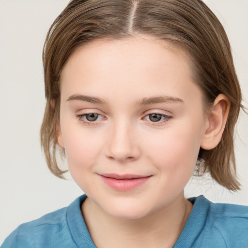 Joyful white child female with medium  brown hair and grey eyes