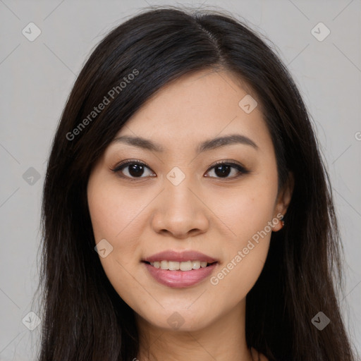 Joyful asian young-adult female with long  brown hair and brown eyes