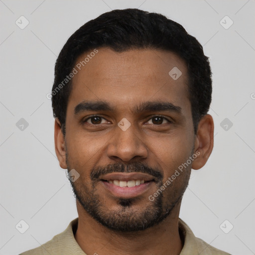 Joyful black young-adult male with short  black hair and brown eyes