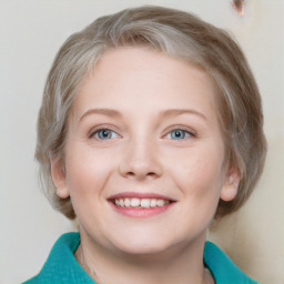 Joyful white young-adult female with medium  brown hair and blue eyes