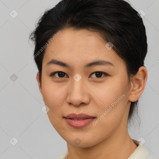 Joyful asian young-adult female with short  brown hair and brown eyes