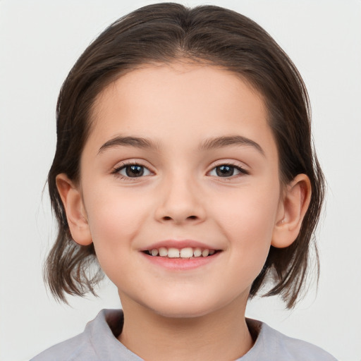 Joyful white child female with medium  brown hair and brown eyes