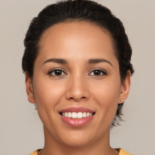 Joyful white young-adult female with medium  brown hair and brown eyes