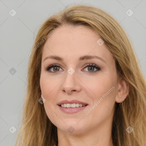 Joyful white young-adult female with long  brown hair and brown eyes