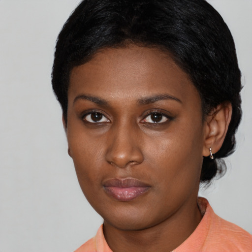 Neutral latino young-adult female with short  black hair and brown eyes