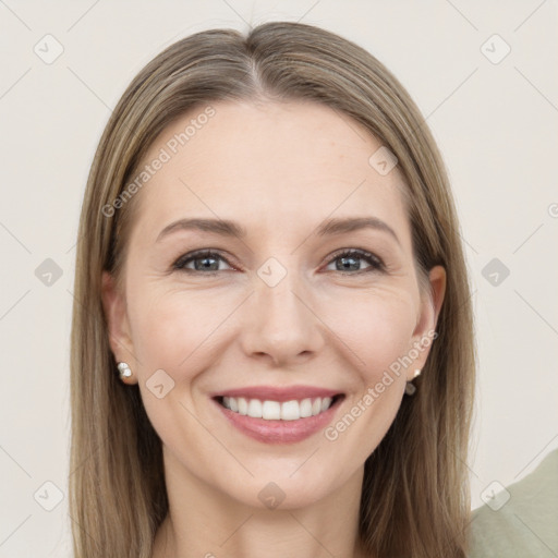 Joyful white young-adult female with long  brown hair and grey eyes