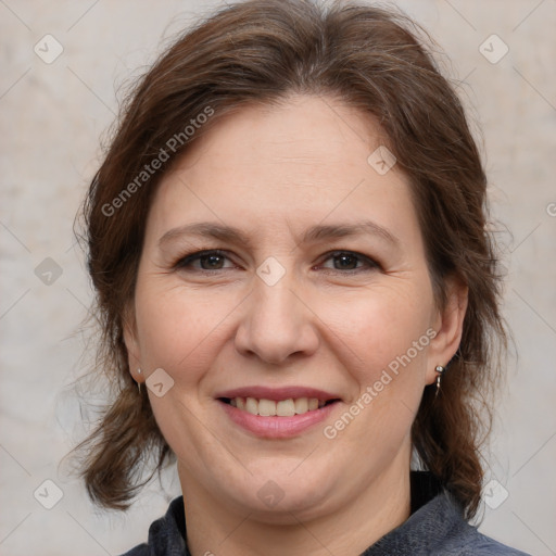 Joyful white adult female with medium  brown hair and brown eyes