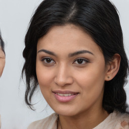 Joyful latino young-adult female with medium  brown hair and brown eyes