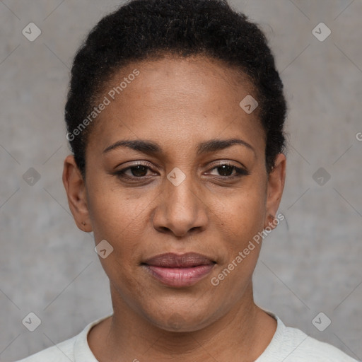 Joyful black young-adult female with short  black hair and brown eyes