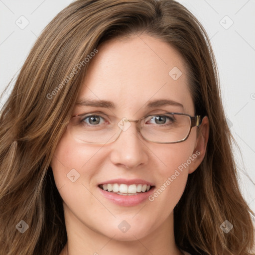 Joyful white young-adult female with long  brown hair and green eyes