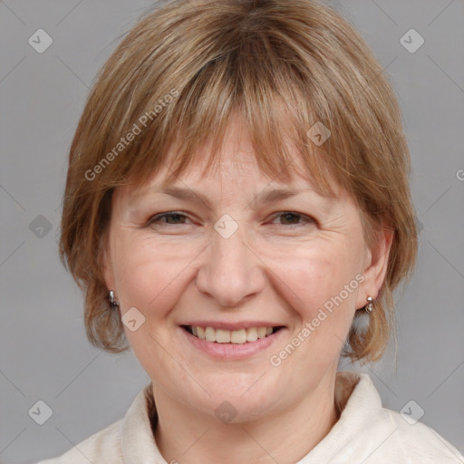 Joyful white adult female with medium  brown hair and blue eyes