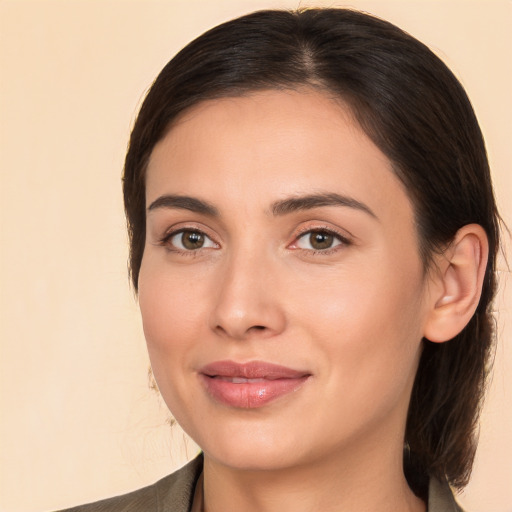 Joyful white young-adult female with medium  brown hair and brown eyes