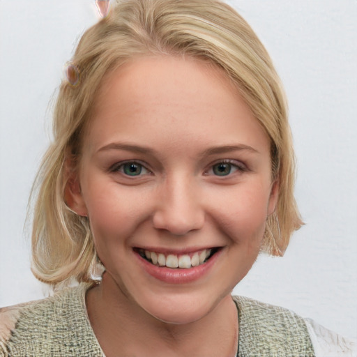 Joyful white young-adult female with medium  brown hair and blue eyes