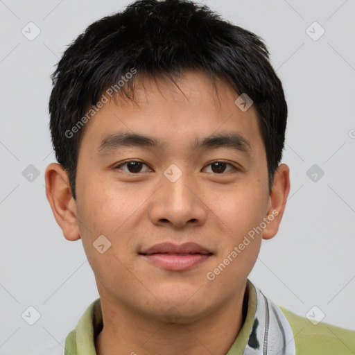 Joyful asian young-adult male with short  brown hair and brown eyes