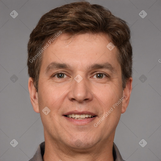 Joyful white adult male with short  brown hair and brown eyes