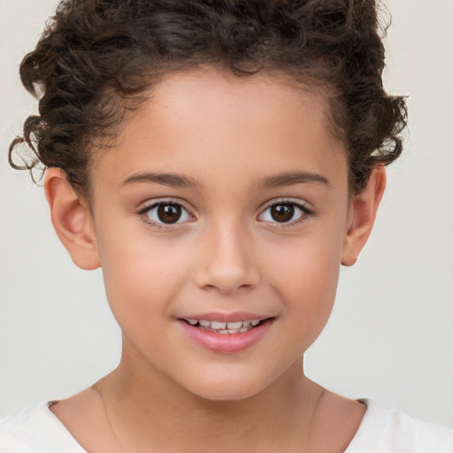 Joyful white child female with short  brown hair and brown eyes