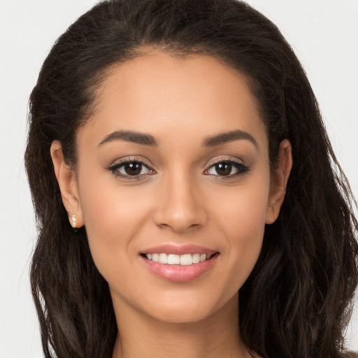 Joyful white young-adult female with long  brown hair and brown eyes