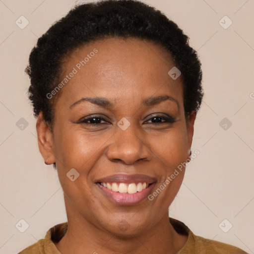 Joyful black adult female with short  brown hair and brown eyes