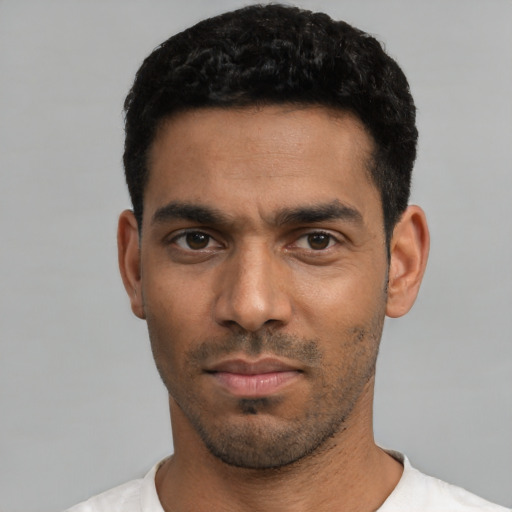 Neutral latino young-adult male with short  black hair and brown eyes