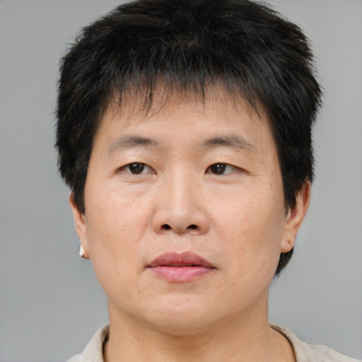 Neutral asian young-adult male with short  brown hair and brown eyes