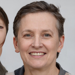 Joyful white adult female with short  brown hair and brown eyes