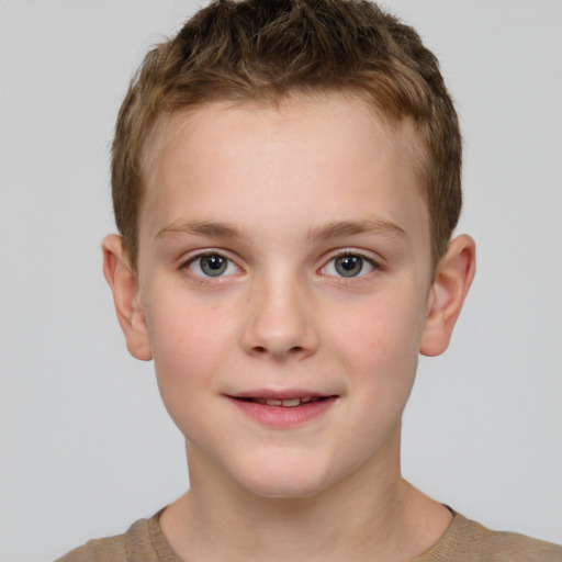 Joyful white child male with short  brown hair and brown eyes