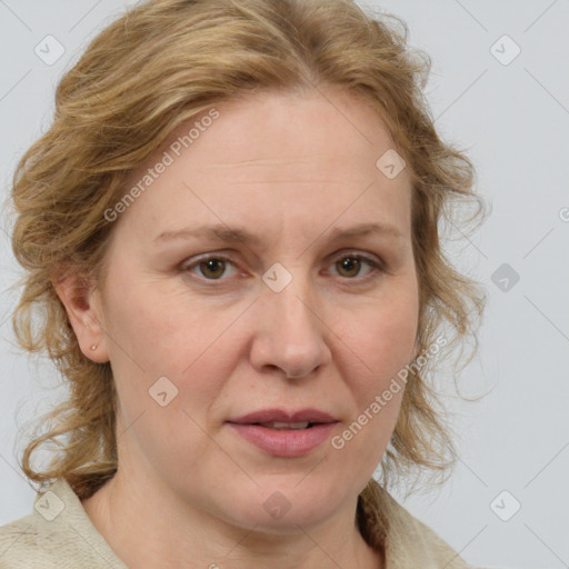 Joyful white adult female with medium  brown hair and blue eyes