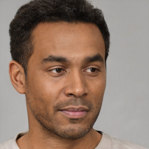 Neutral latino young-adult male with short  brown hair and brown eyes