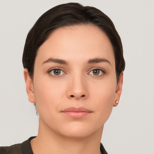 Neutral white young-adult female with short  brown hair and brown eyes