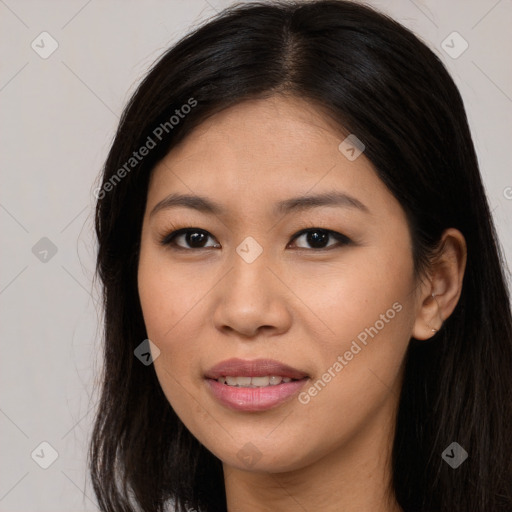 Joyful asian young-adult female with long  brown hair and brown eyes