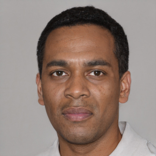 Neutral black adult male with short  black hair and brown eyes