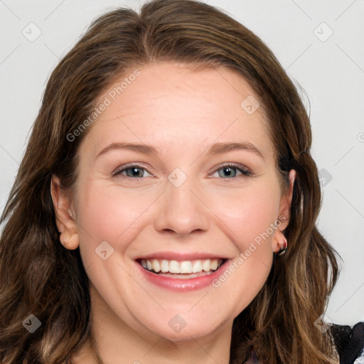 Joyful white young-adult female with long  brown hair and blue eyes