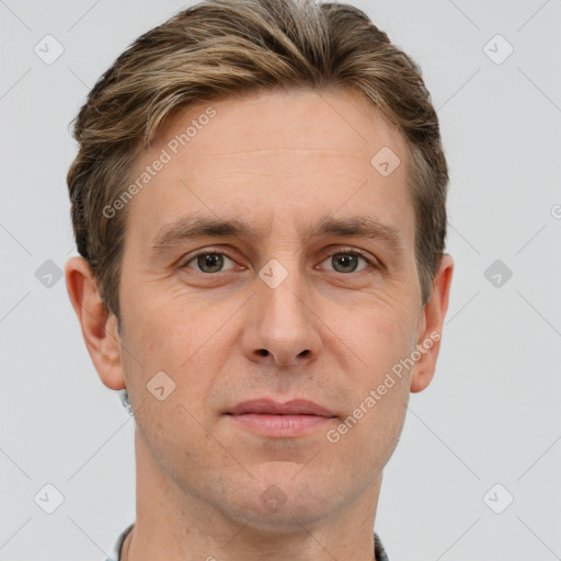 Joyful white adult male with short  brown hair and grey eyes