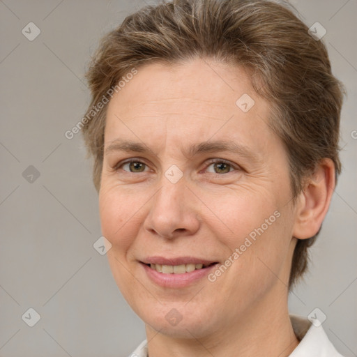 Joyful white adult female with short  brown hair and brown eyes