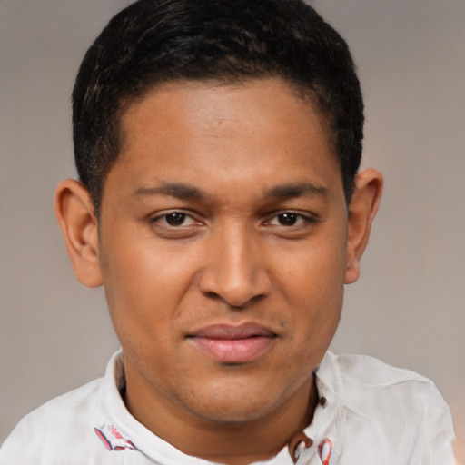 Joyful latino young-adult male with short  brown hair and brown eyes