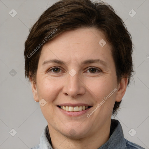 Joyful white adult female with medium  brown hair and brown eyes