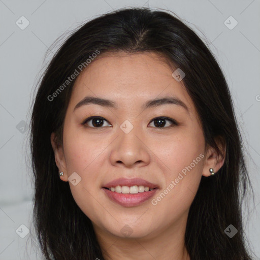 Joyful asian young-adult female with long  brown hair and brown eyes