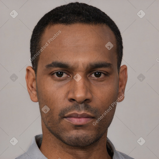Neutral latino young-adult male with short  black hair and brown eyes