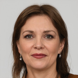 Joyful white adult female with medium  brown hair and grey eyes