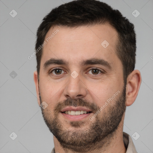 Joyful white young-adult male with short  brown hair and brown eyes