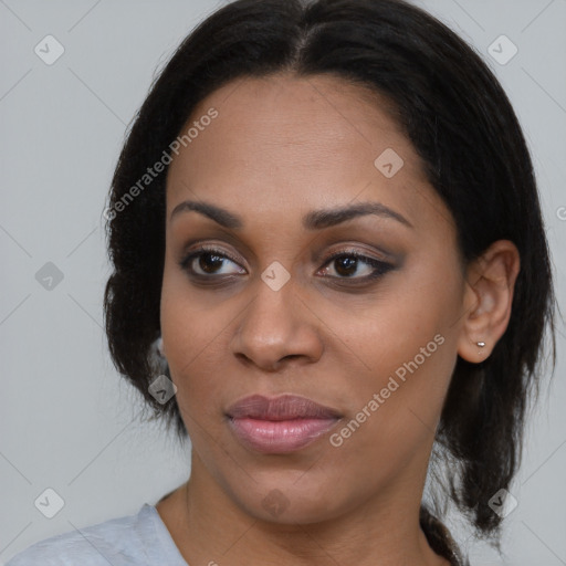 Joyful black young-adult female with medium  brown hair and brown eyes