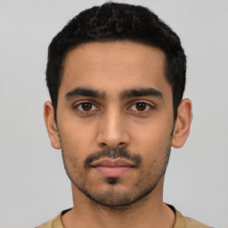 Neutral latino young-adult male with short  black hair and brown eyes