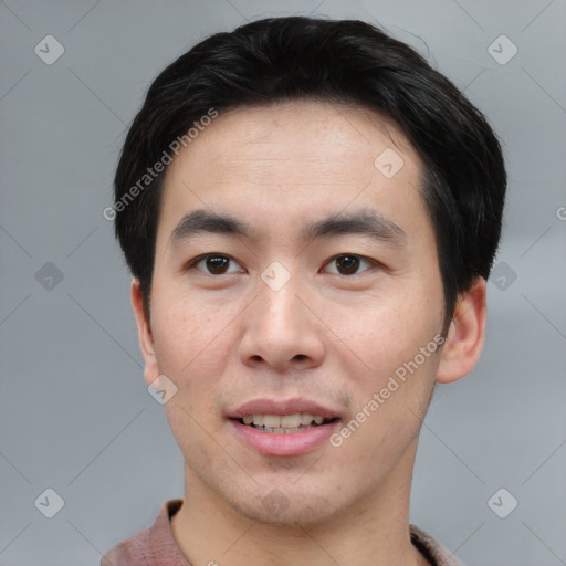 Joyful asian young-adult male with short  black hair and brown eyes